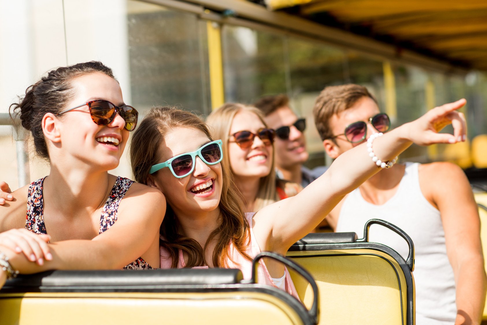 Tourists having fun sightseeing while on a bus tour